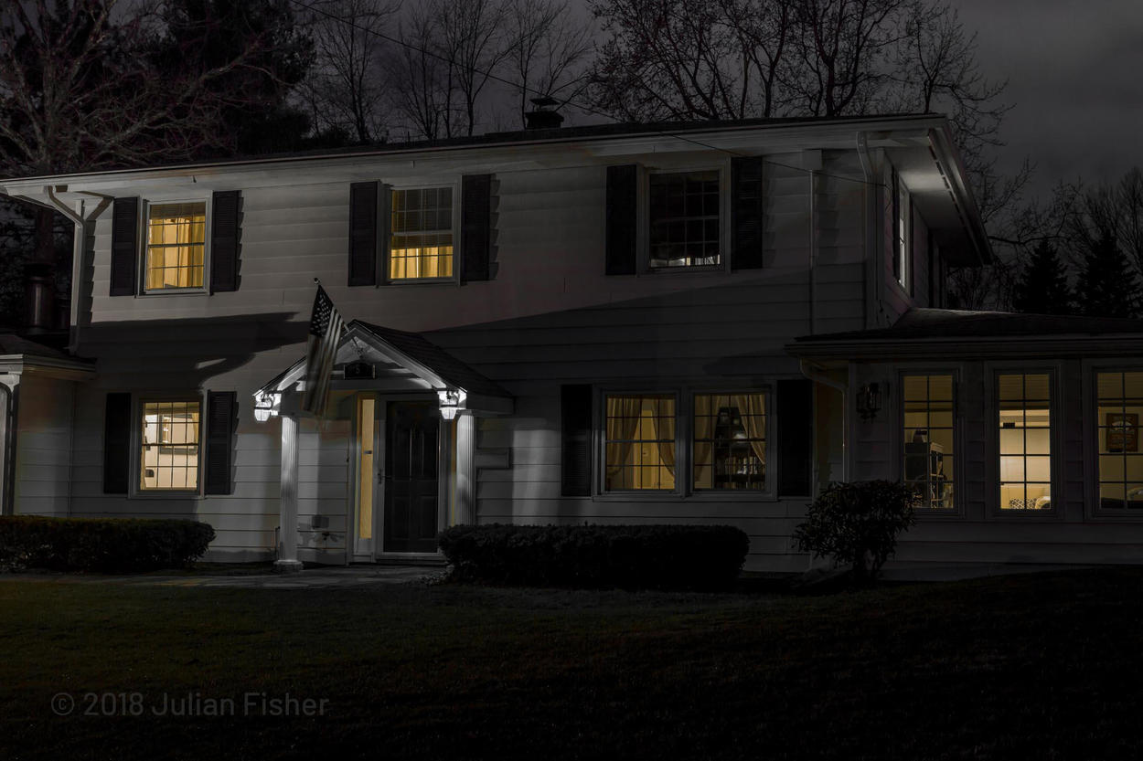 nighttime view of new england home
