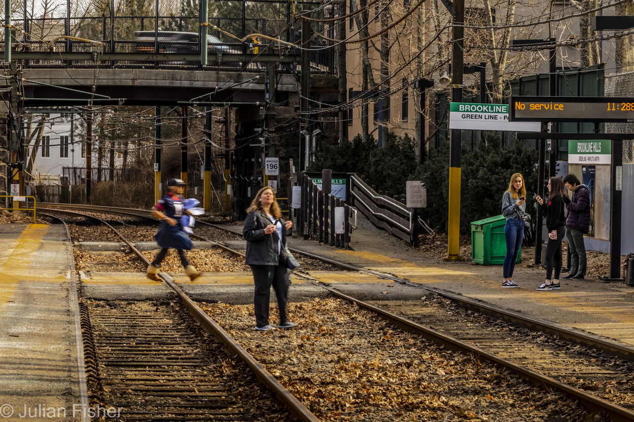 woman walking on train tracks