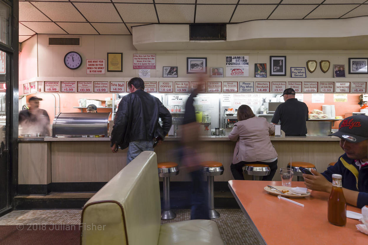 view of diner counter with people eating