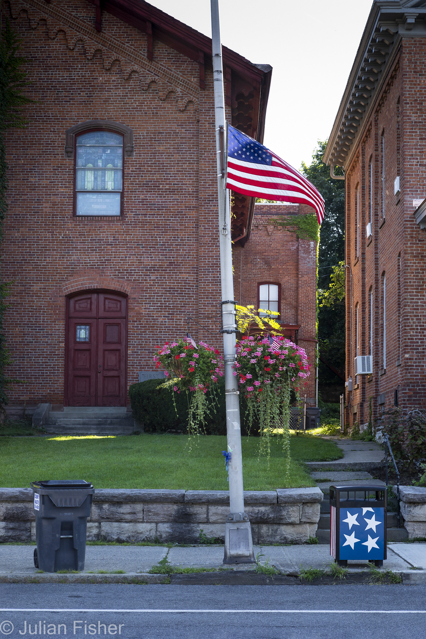 american flag at half staff